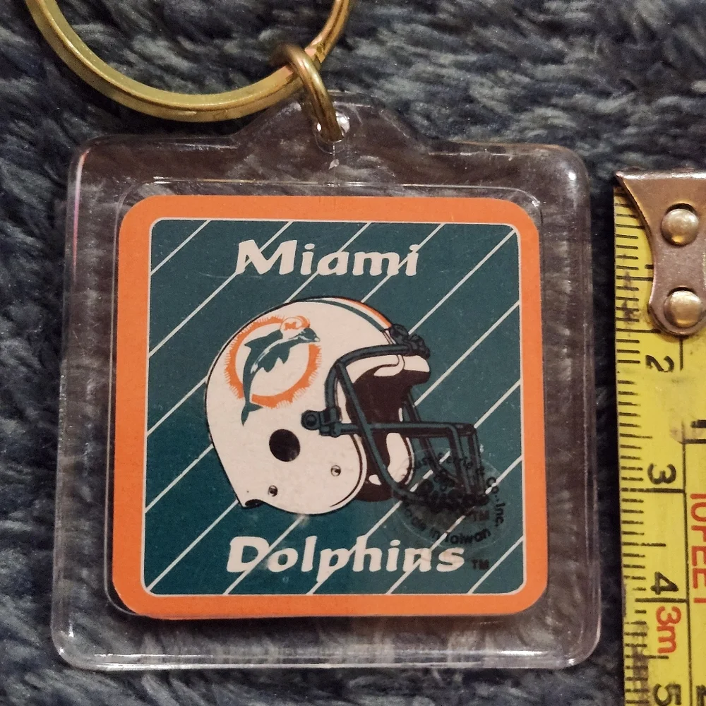 vintage Miami Dolphins acrylic keychain likely dates back to the 1970s or 1980